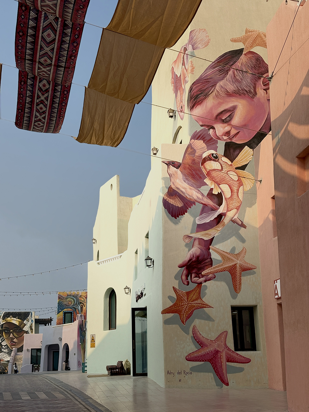 Street art in a cultural district of Doha, using colours and imagery to express local identity and community stories.