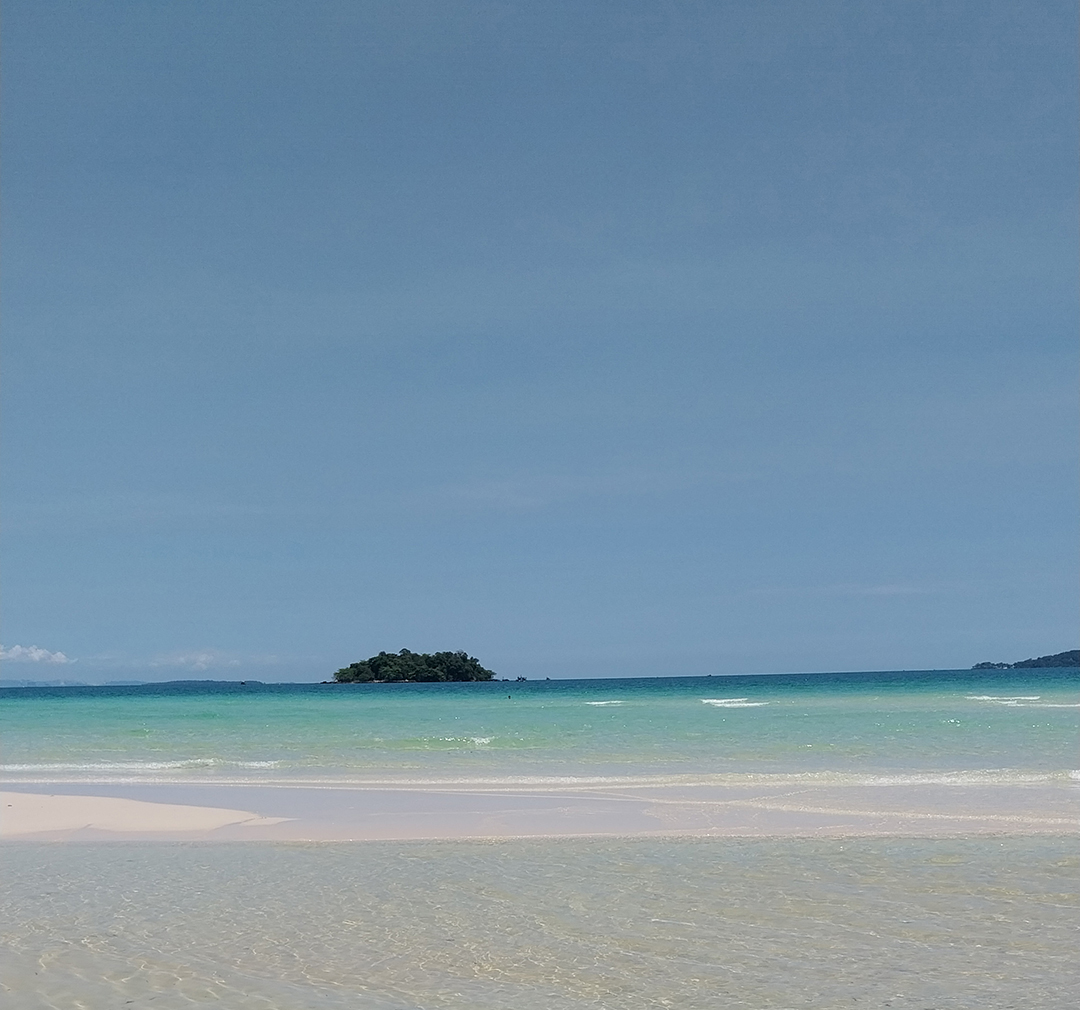 White sandy beach and turquoise sea on Koh Rong Island, one of Cambodia’s most beautiful tropical destinations.