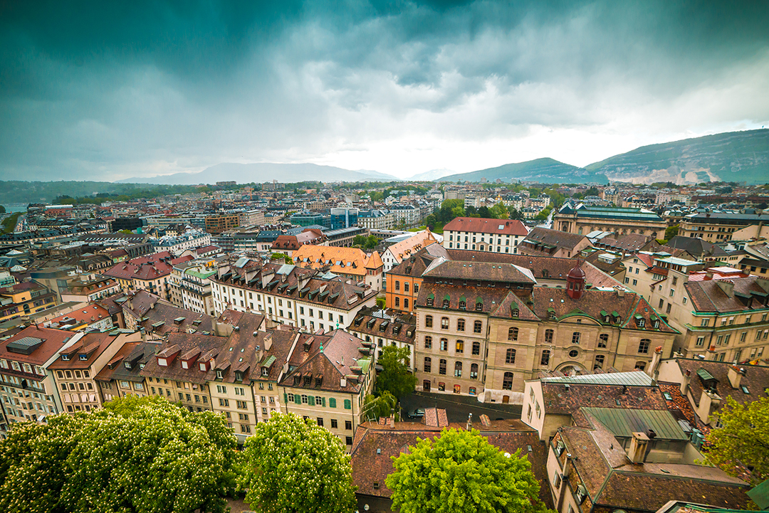 Panoramic view of Geneva’s old town with historic rooftops and church towers representing the city’s reformist heritage.