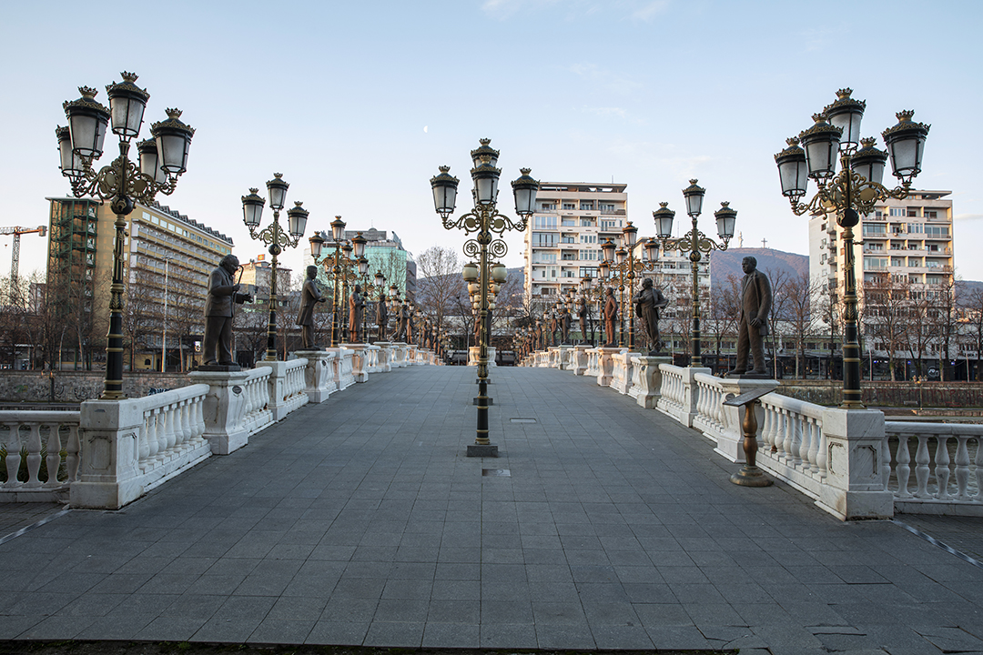 Art Bridge lined with statues of historical figures in Skopje
