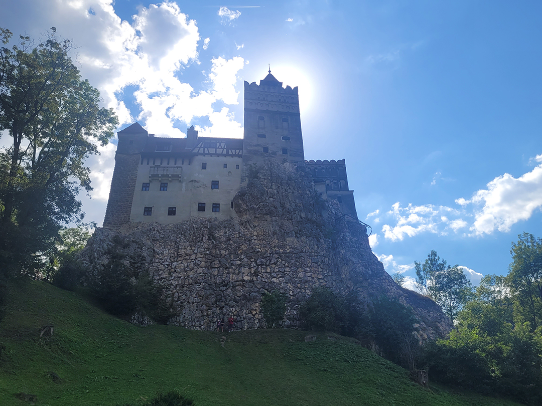 Bran Castle on a rocky hill in Transylvania, also known as Dracula's Castle.