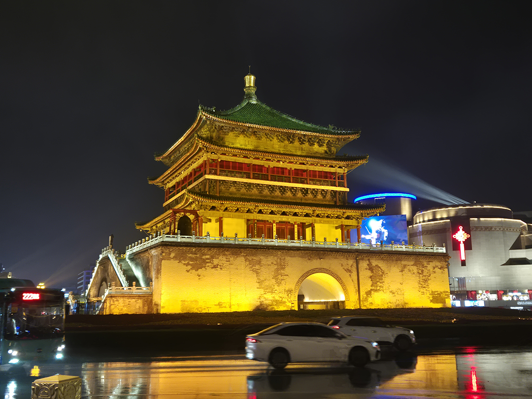 Illuminated Bell Tower of Xian at night in the historic city centre.